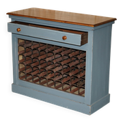 Vintage wooden furniture for 45 wine bottles with a drawer.