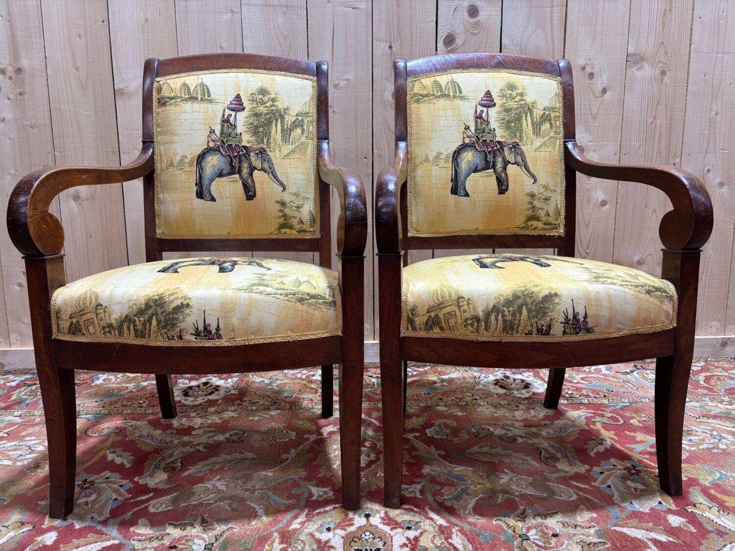 Pair of 19th-century armchairs with a scrolled back