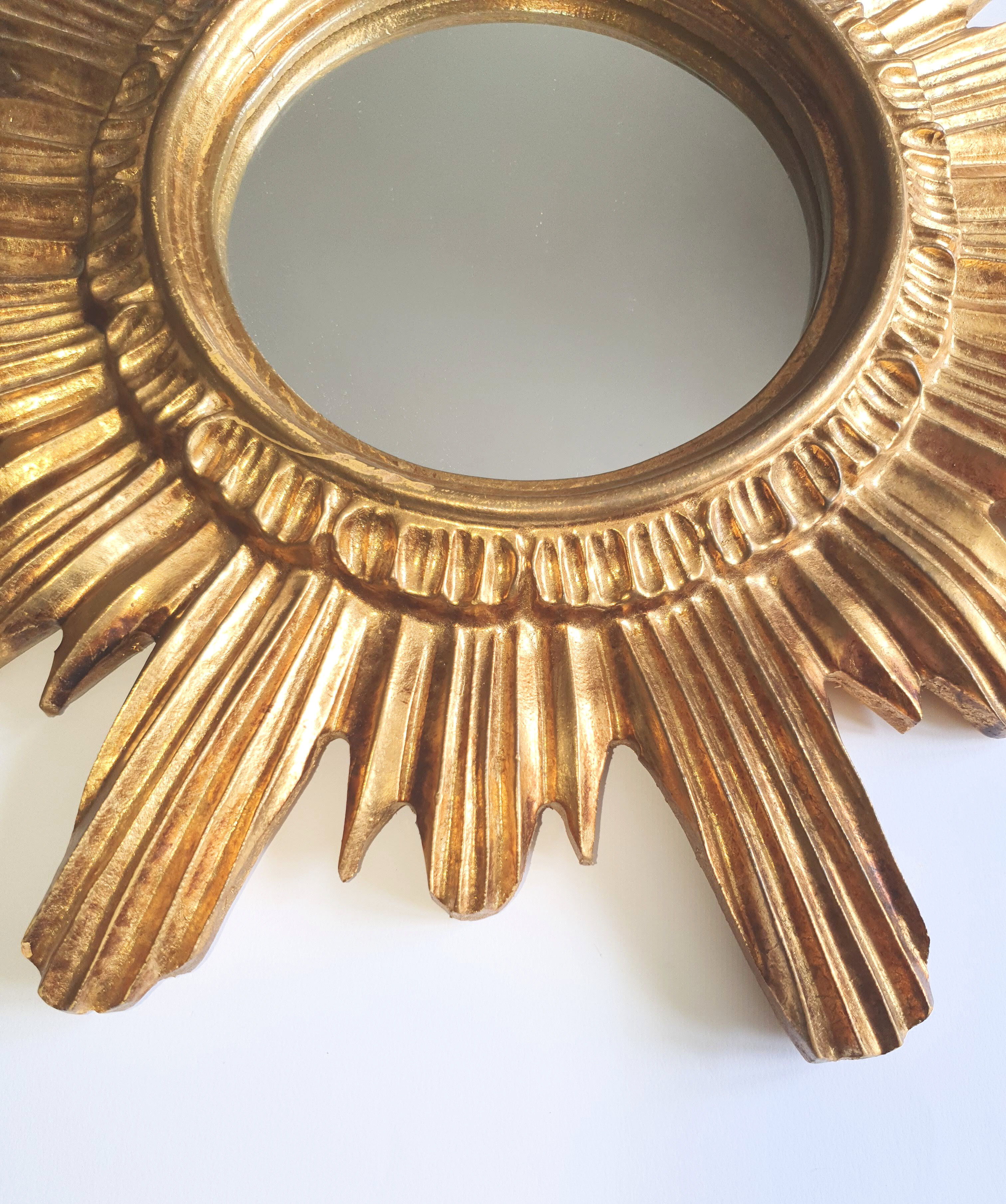 Sun mirror in gilded wood