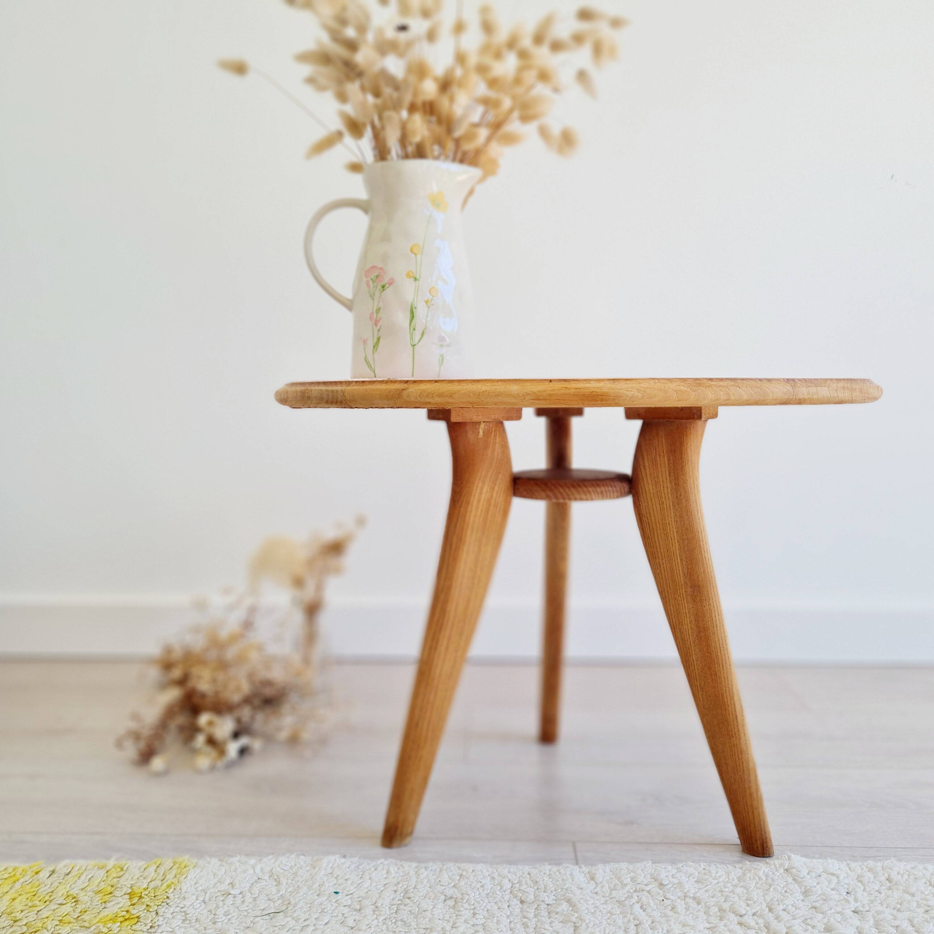 Pink round top tripod coffee table