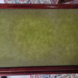 Living room coffee table with green leather and wood top