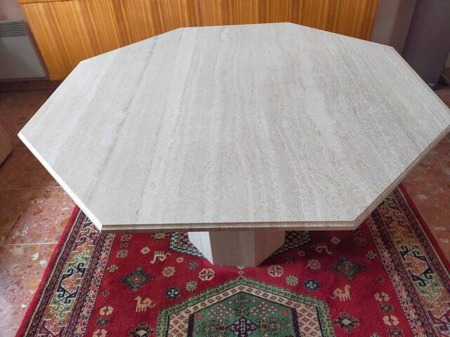 Octagonal dining table in travertine