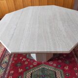Octagonal dining table in travertine