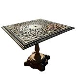 Antique cast iron garden table with decorative openwork top.