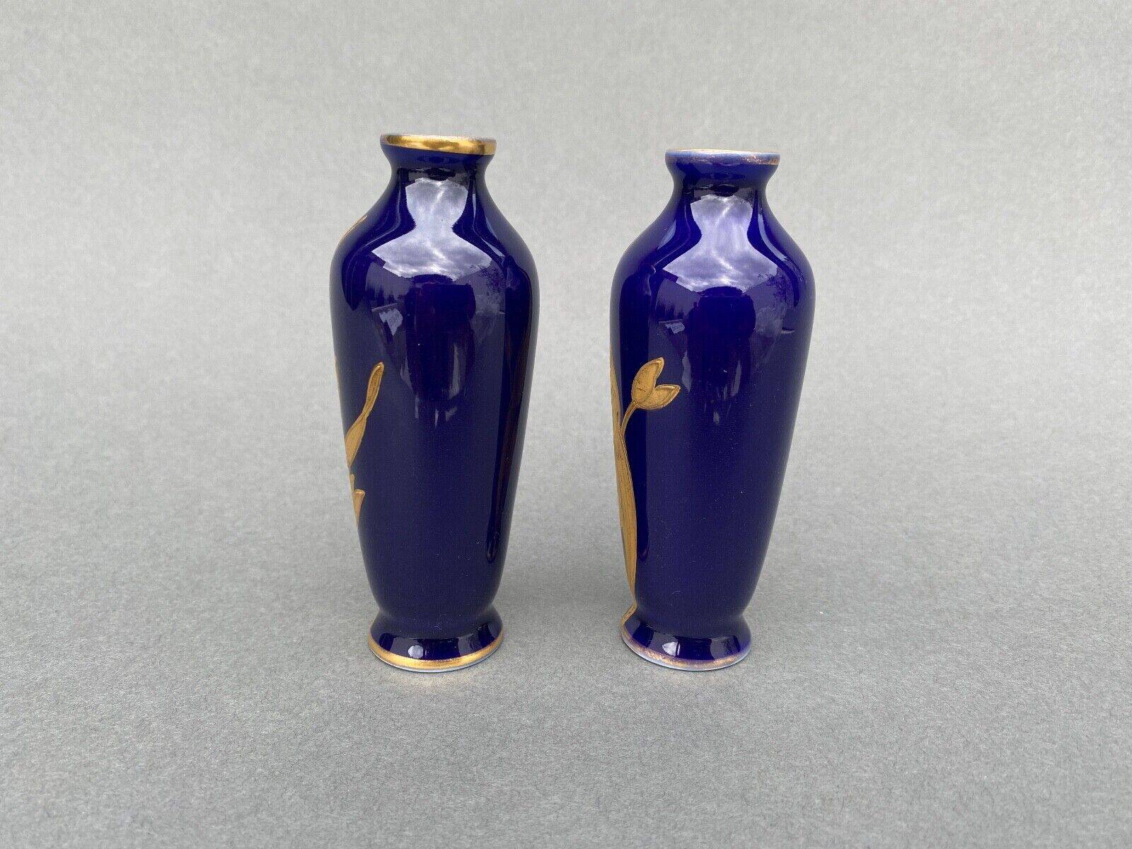 Pair of 1900 Limoges vases with blue background and gold highlights, R. Rosier decorations