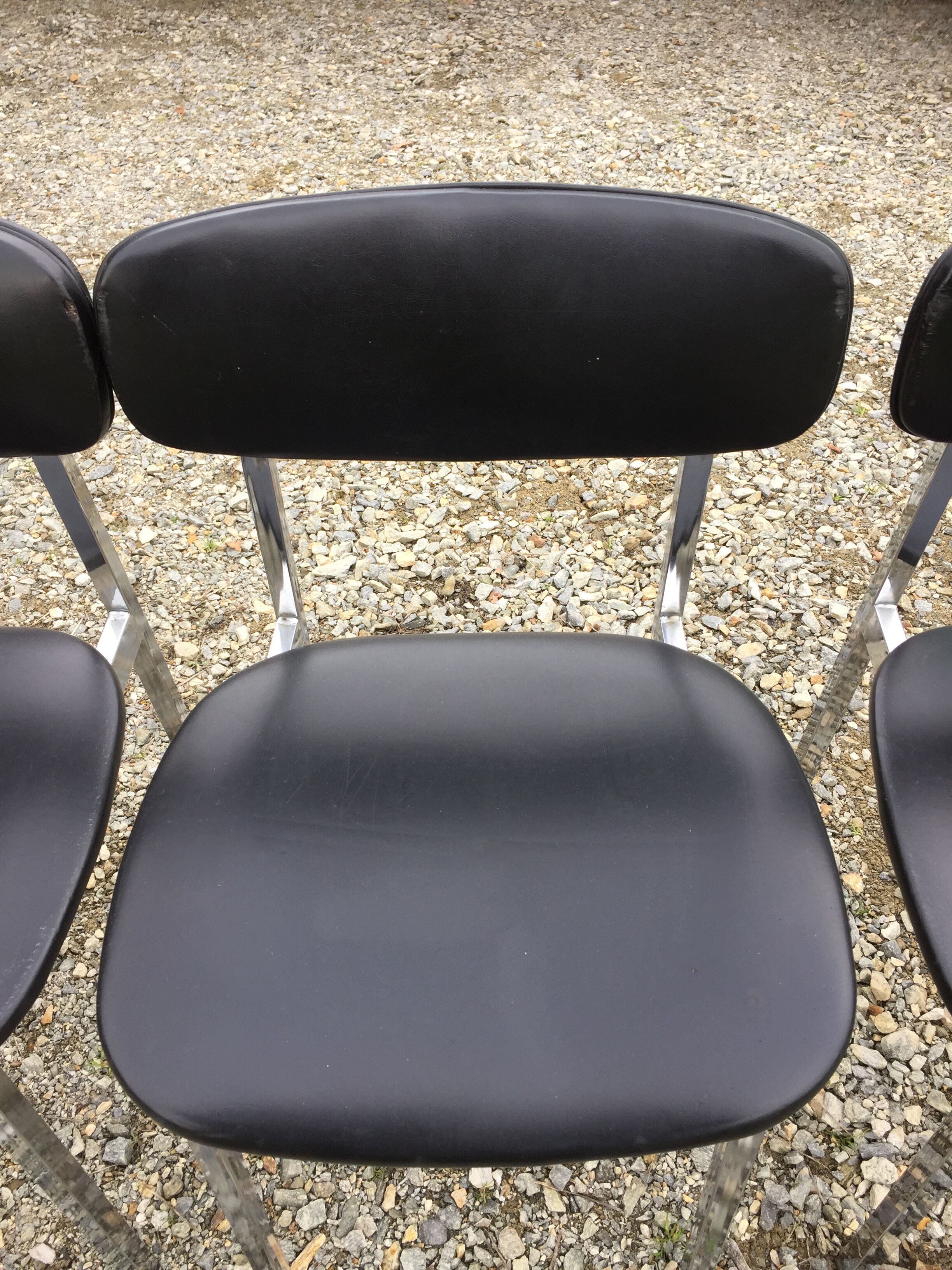 6 vintage chairs in black skaï with chrome metal tubular base.