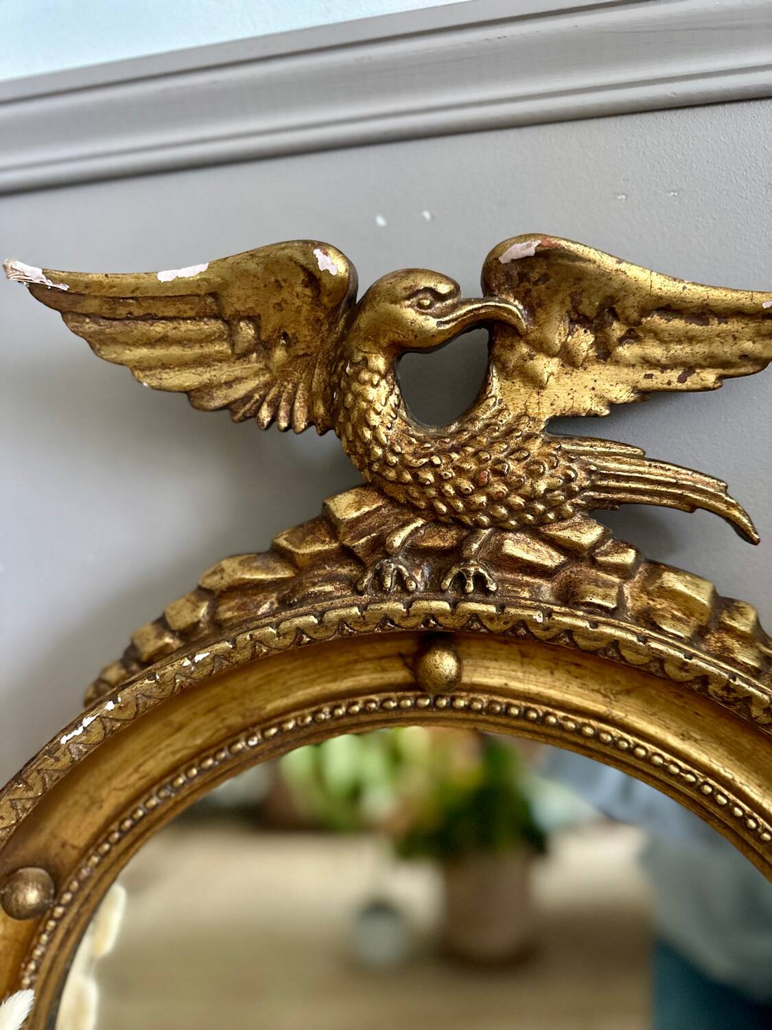 Antique gilded mirror decorated with an eagle