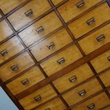 School cabinet bank of vintage Dutch drawers in mid-twentieth century pine