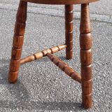 Wooden tripod stool with turned legs