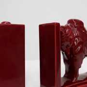 Pair of red glazed ceramic Bison ox bookends in Art Deco style, Belgium