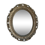 Mirror oval frame carved gilded patinated