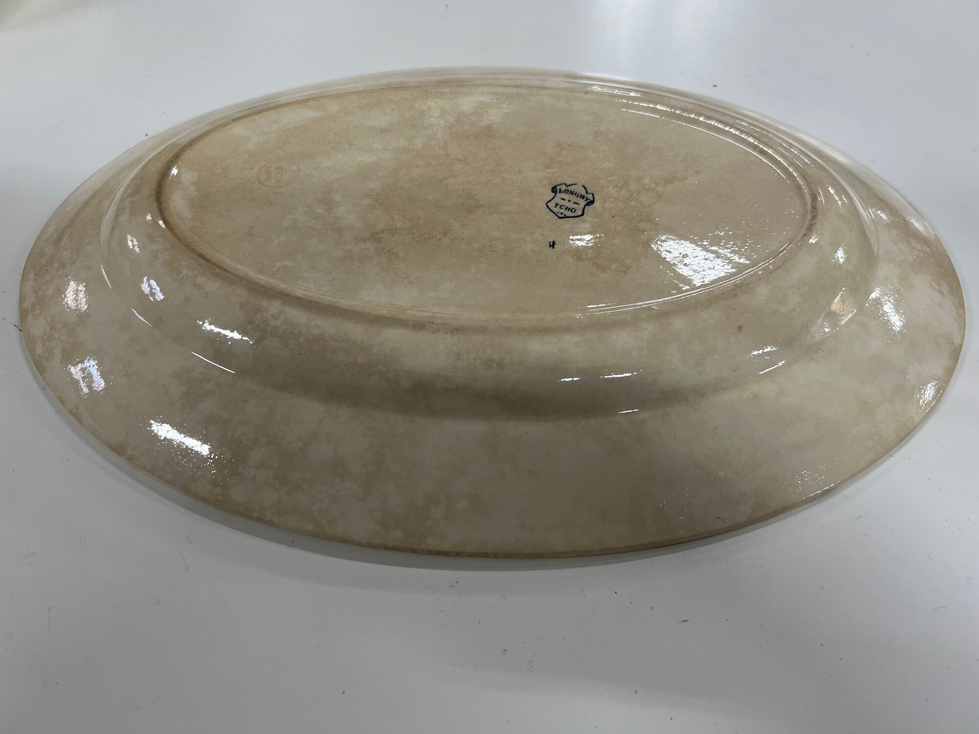 Plat ovale en porcelaine longwy signé yeho