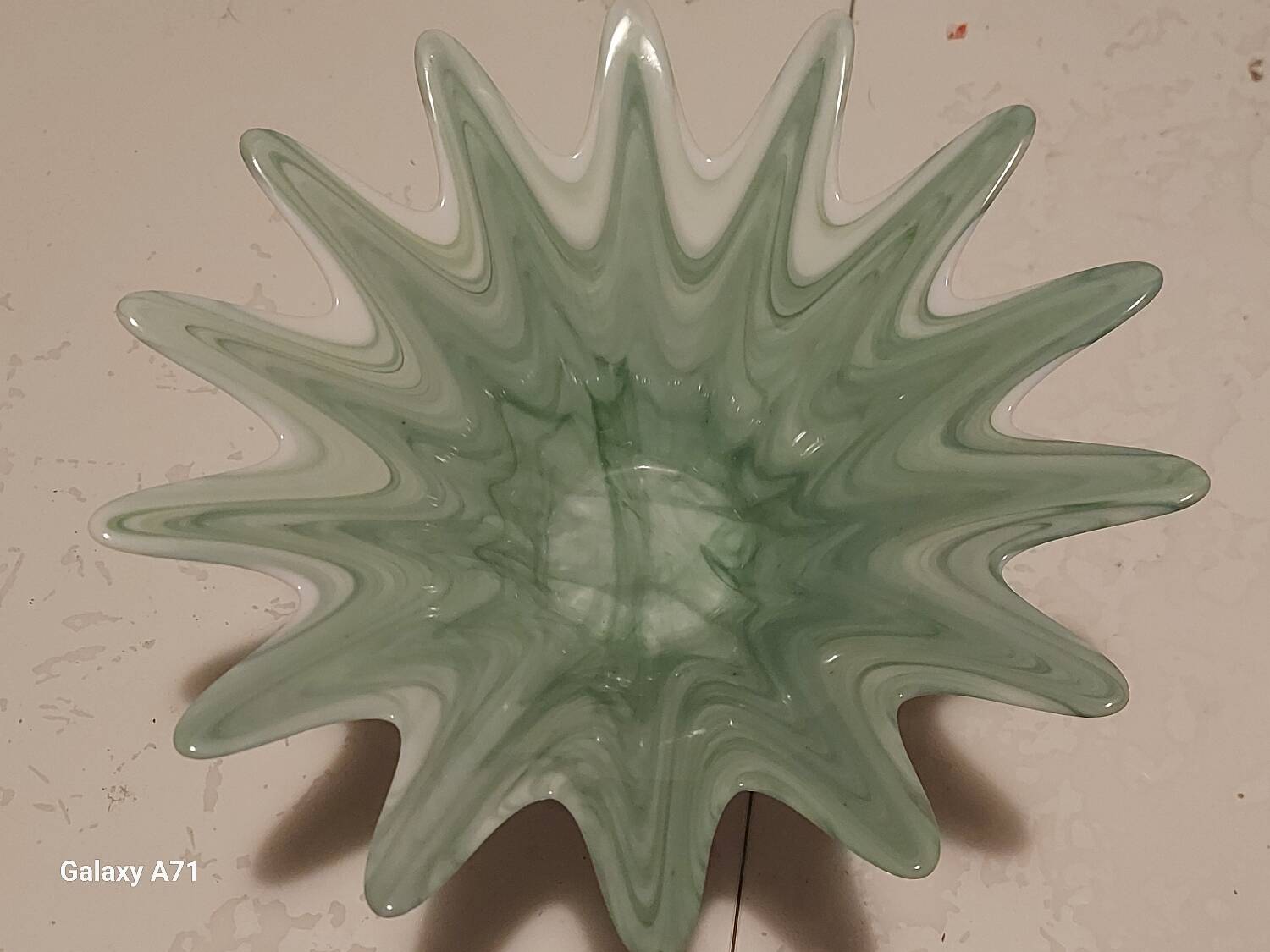 Opalescent glass bowl in the Murano style with a silver-plated metal base.