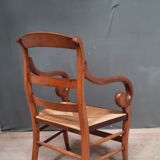 Rustic straw armchair with butts