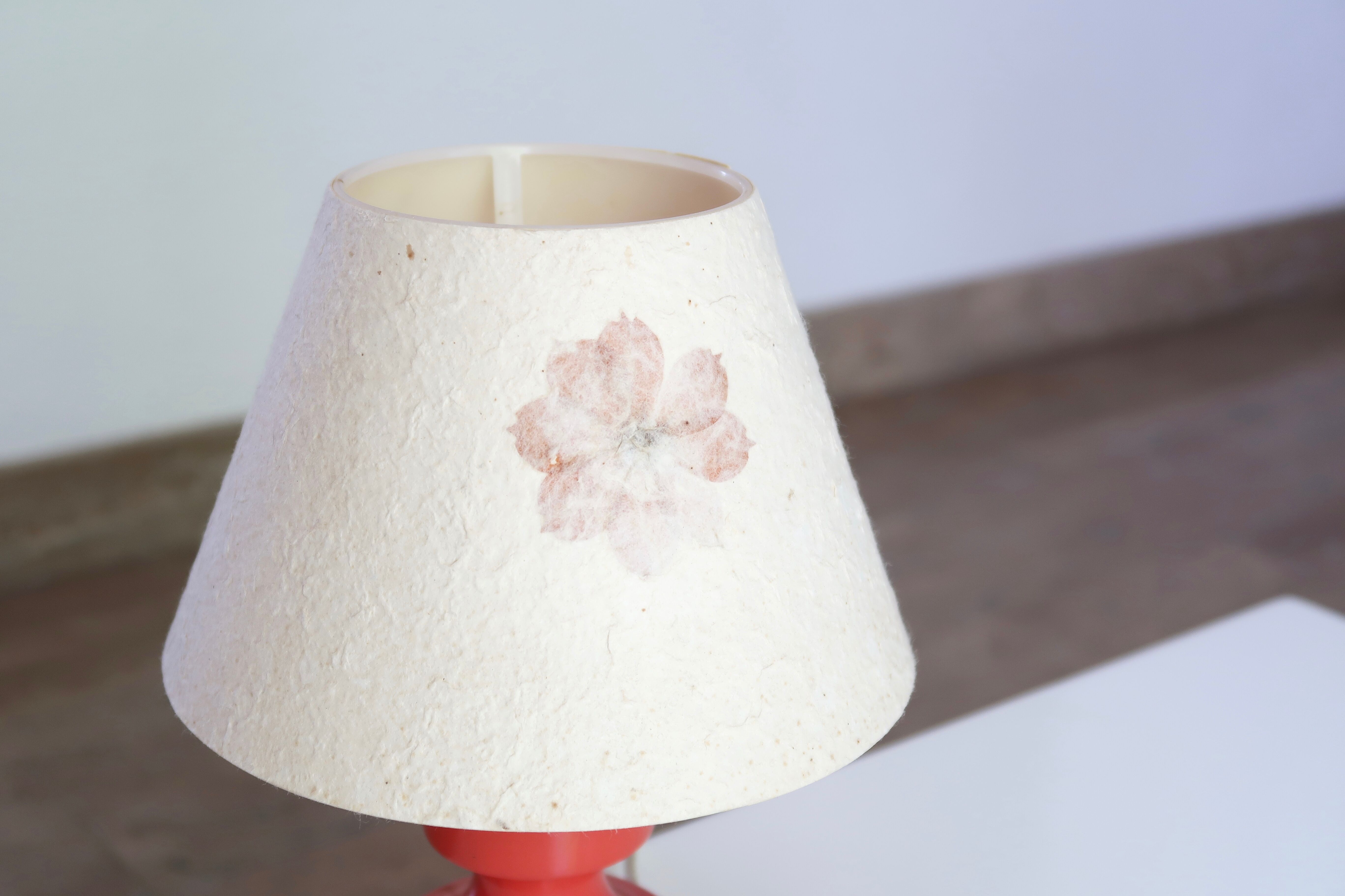 Red wooden lamp with herbarium-style lampshade from the 70s