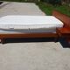 Vintage bed in teak with integrated bedside table.