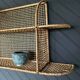 Steel and wicker wall shelf