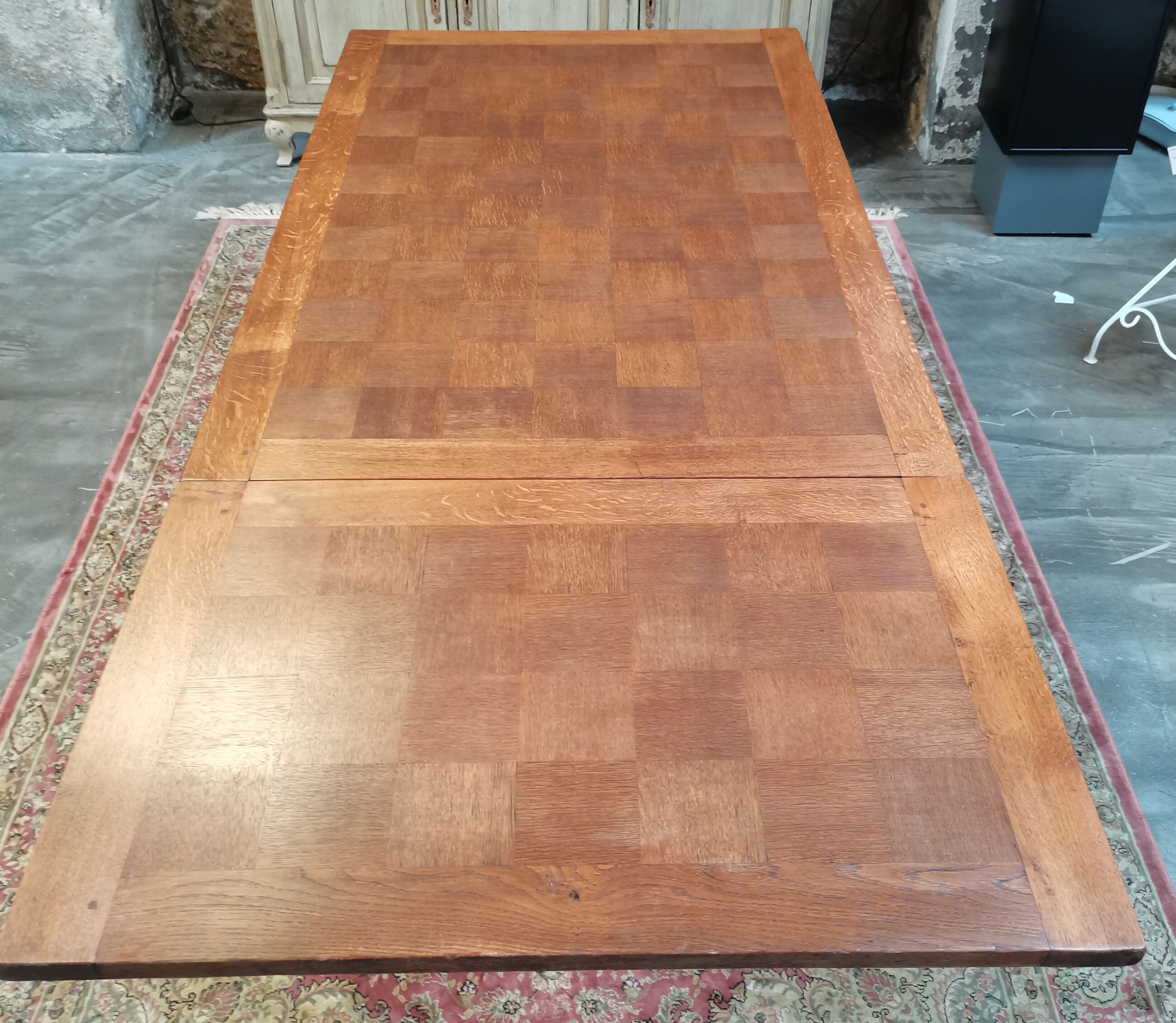 Old table in chene with extension cords