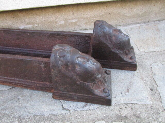 Pair of ancient cast iron channels, antique heads