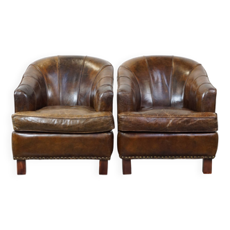2 fauteuils en cuir de vachette