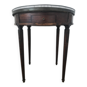 Louis XVI style bouillotte table, with a white marble top.