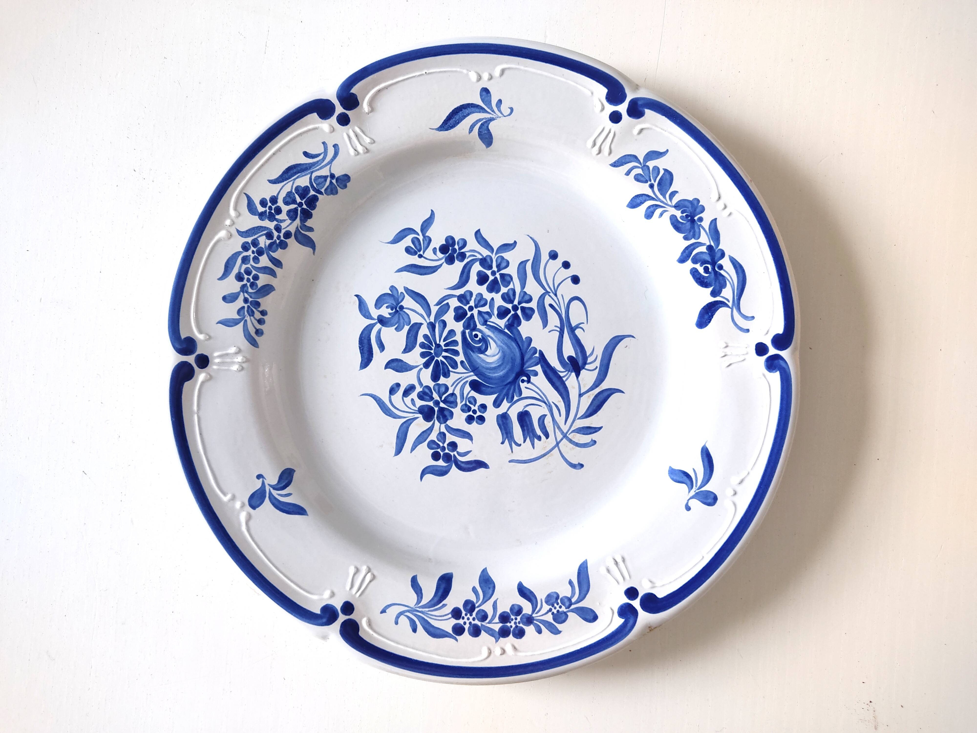 Decorative blue and white earthenware plate