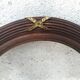 Oval-shaped wooden frame