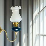 Brass wall sconce with frosted glass tulip lampshade
