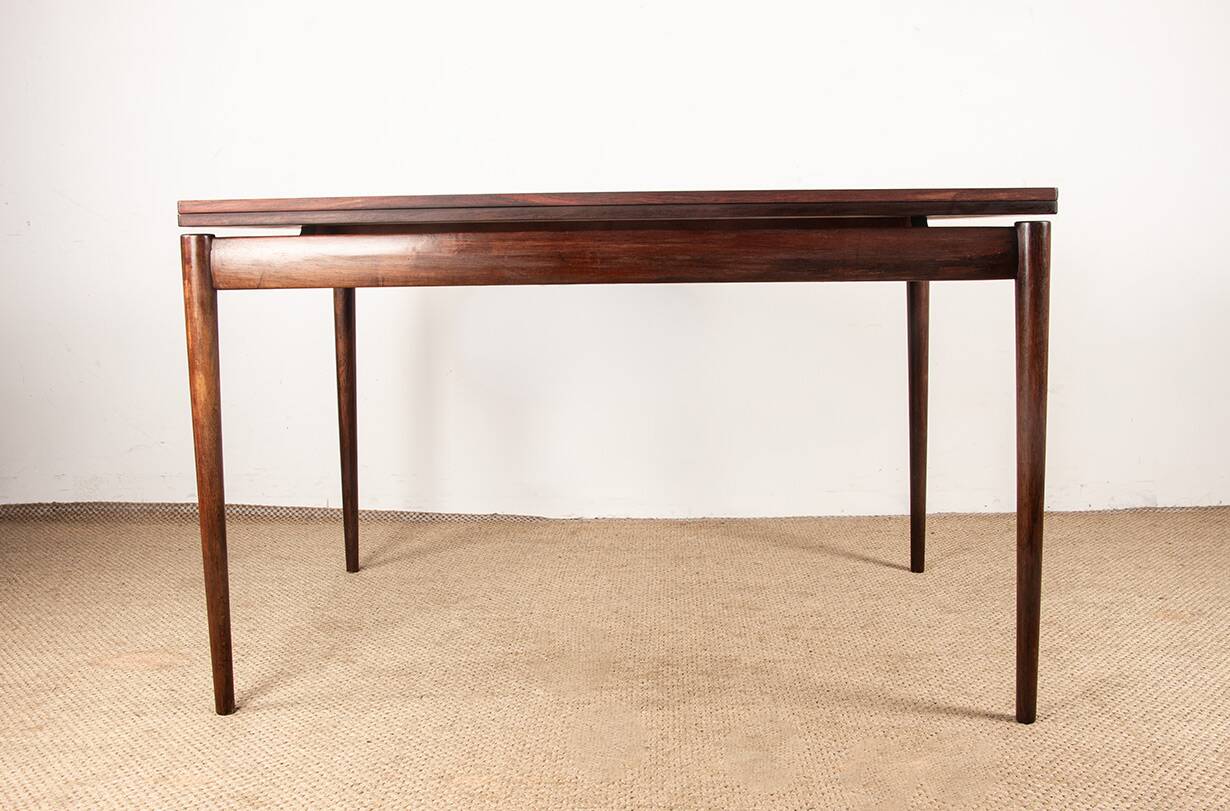 Danish extendable dining table in rosewood and brass by Poul Volther