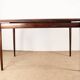 Danish extendable dining table in rosewood and brass by Poul Volther