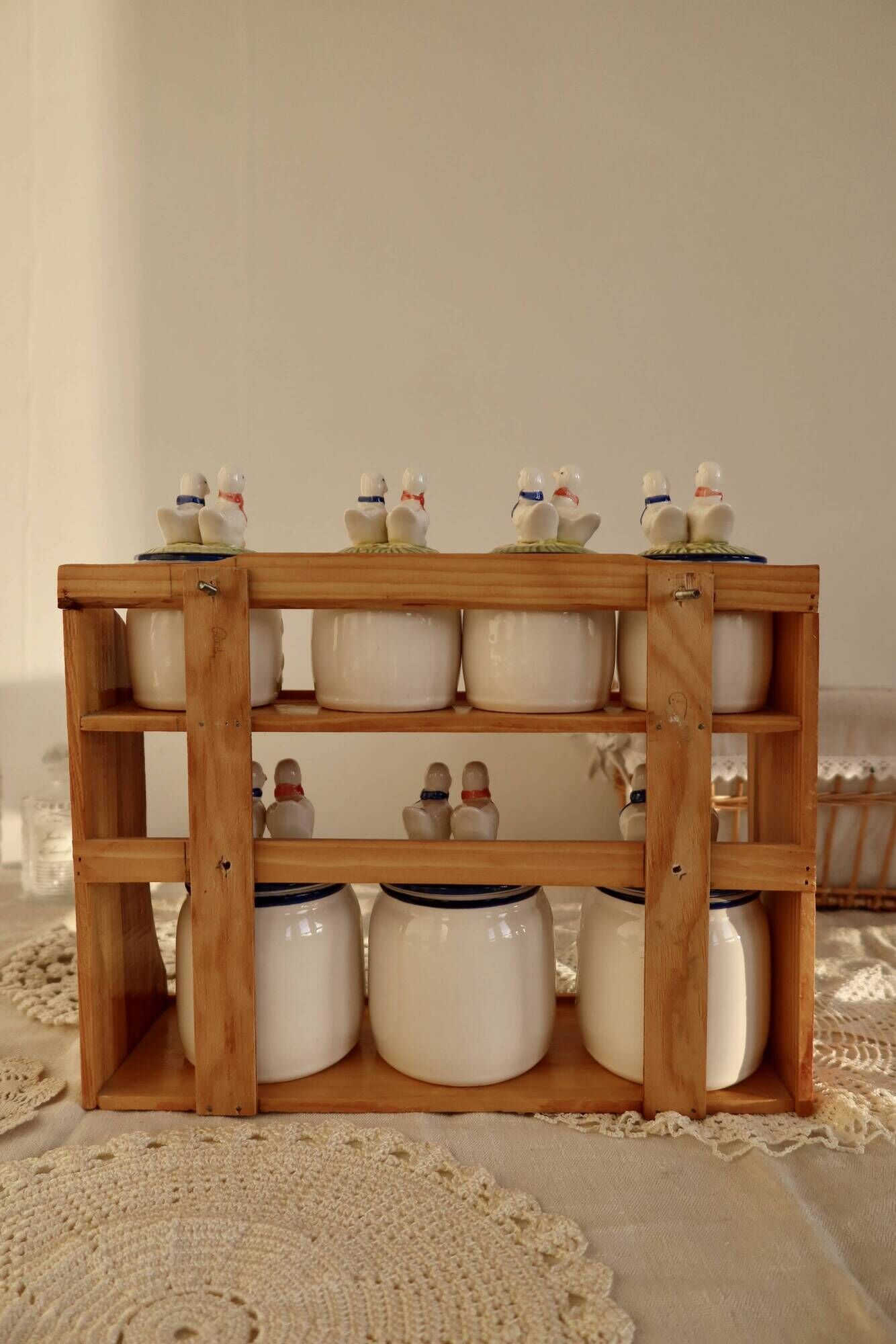 Vintage wooden wall condiment shelf and porcelain pots with geese slip pattern