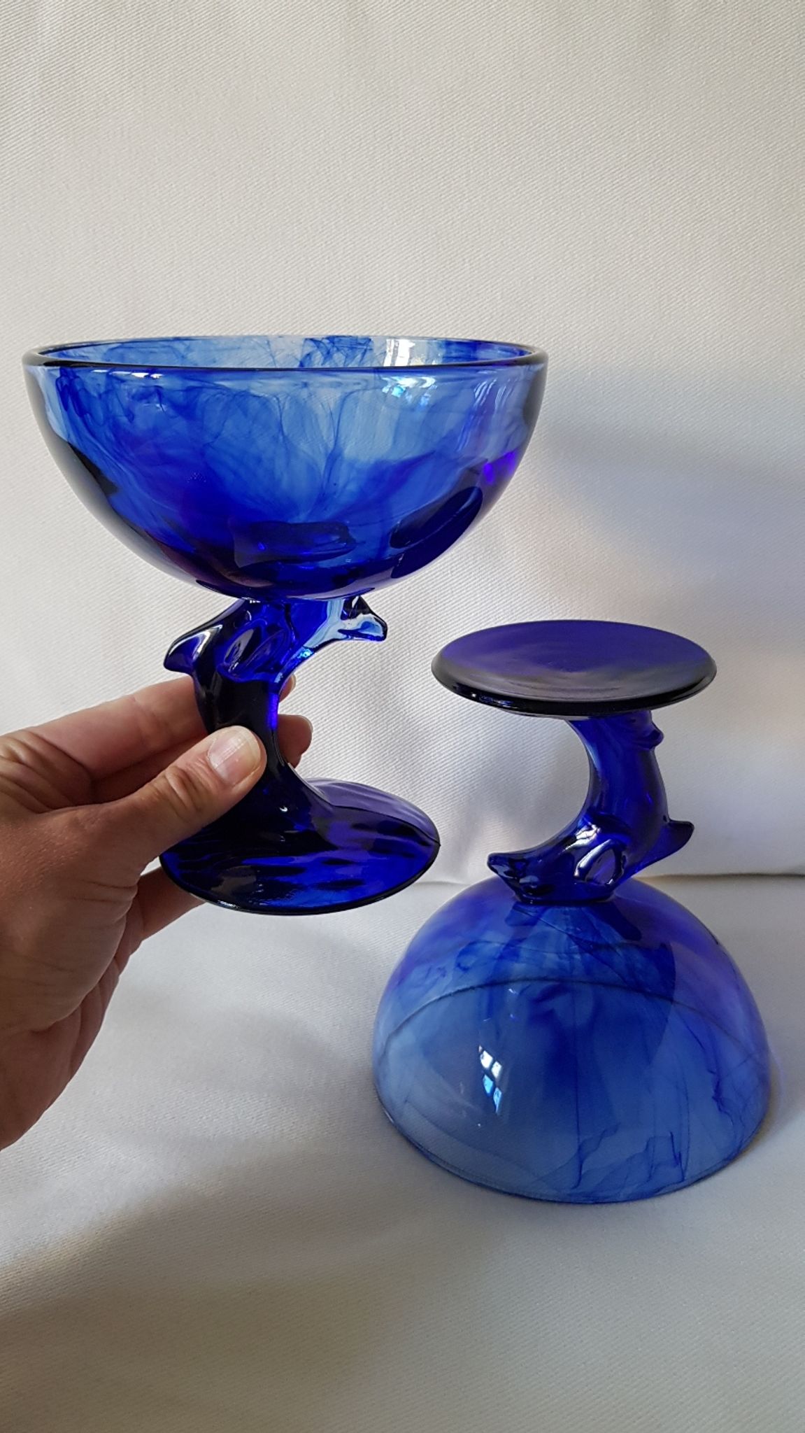 Set of 2 dolphin dessert cups in blue glass.