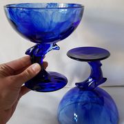 Set of 2 dolphin dessert cups in blue glass.