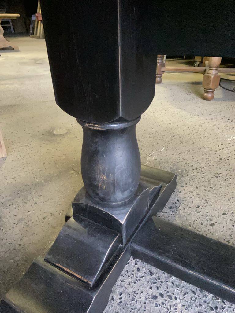 Raw wood table with black legs