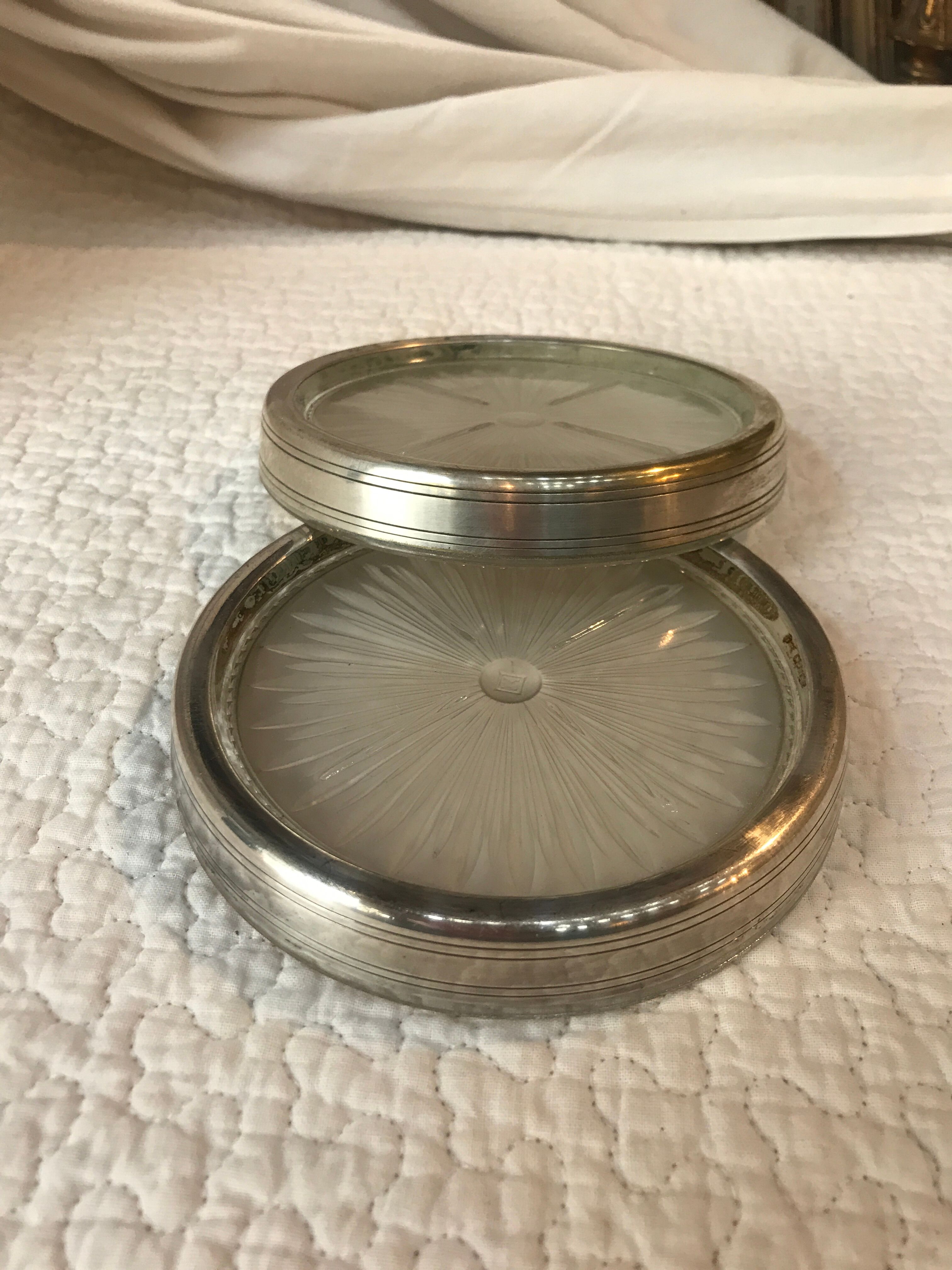 Pair of silver metal and glass bottle bottoms