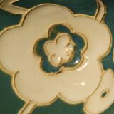 Blue water vase with white floral pattern
