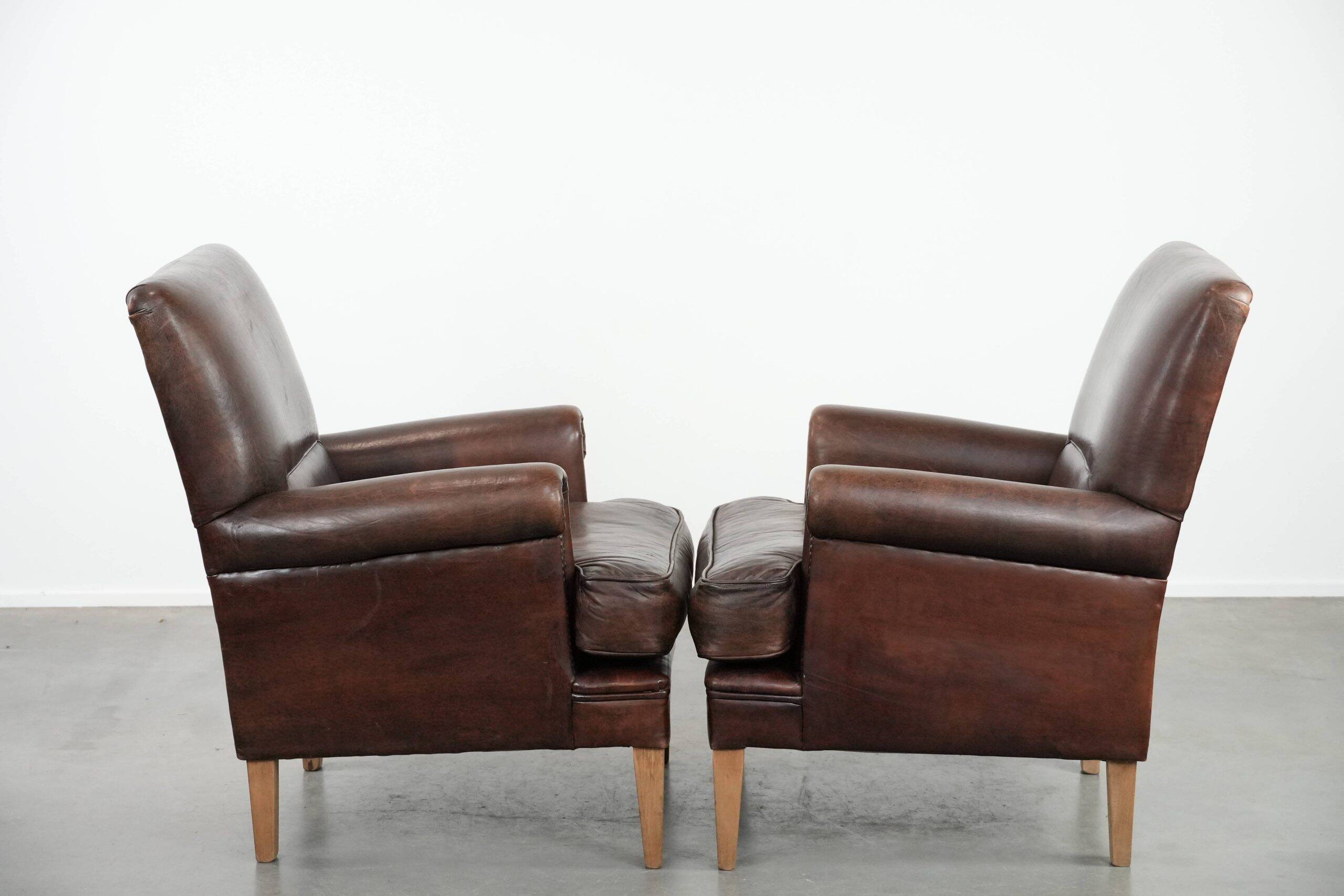 Set of two characterful sheepskin armchairs with a beautiful deep colour