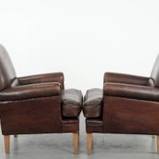 Set of two characterful sheepskin armchairs with a beautiful deep colour