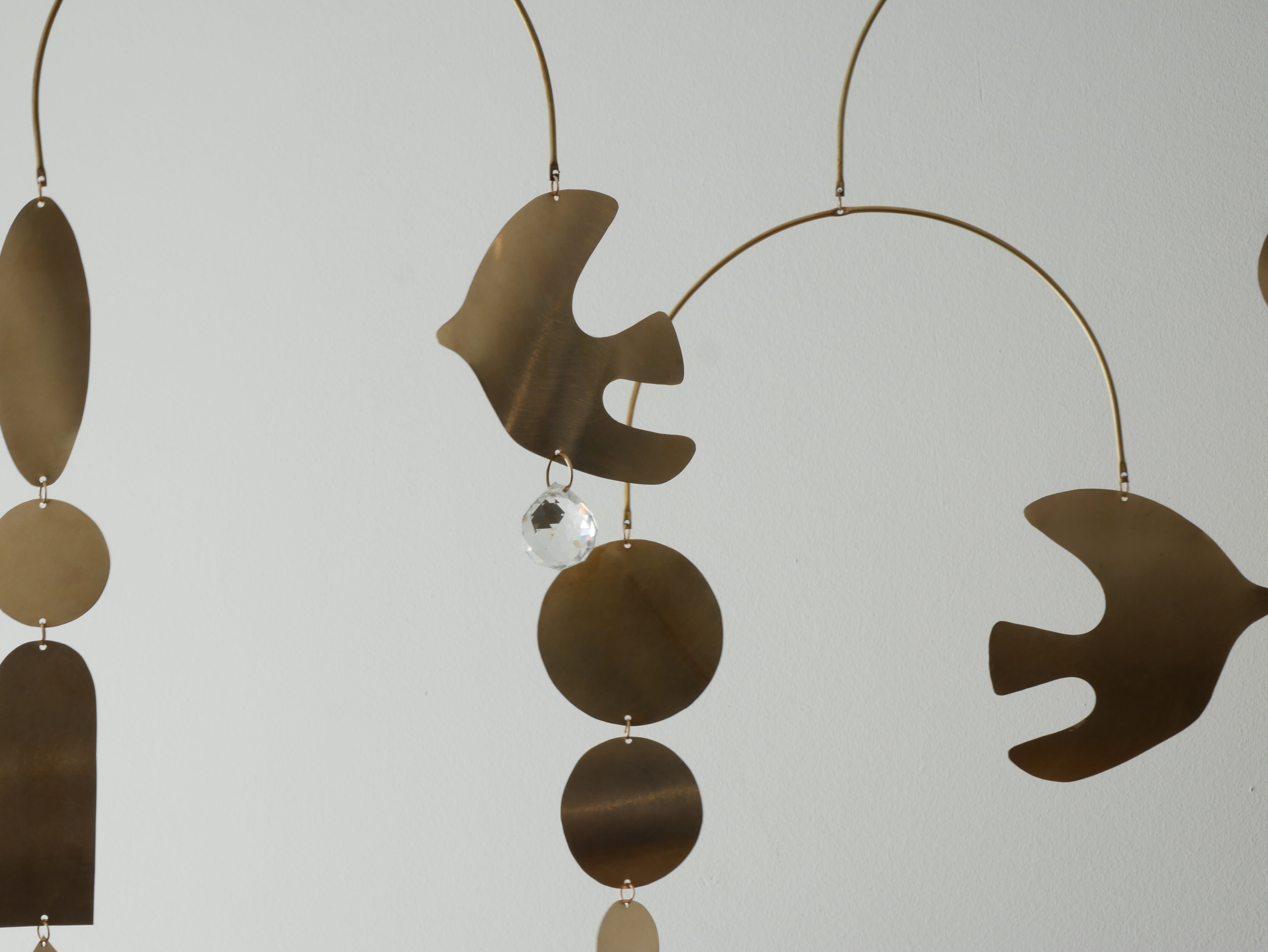 Mobile model Rana . Mobile in abstract brass.