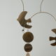 Mobile model Rana . Mobile in abstract brass.