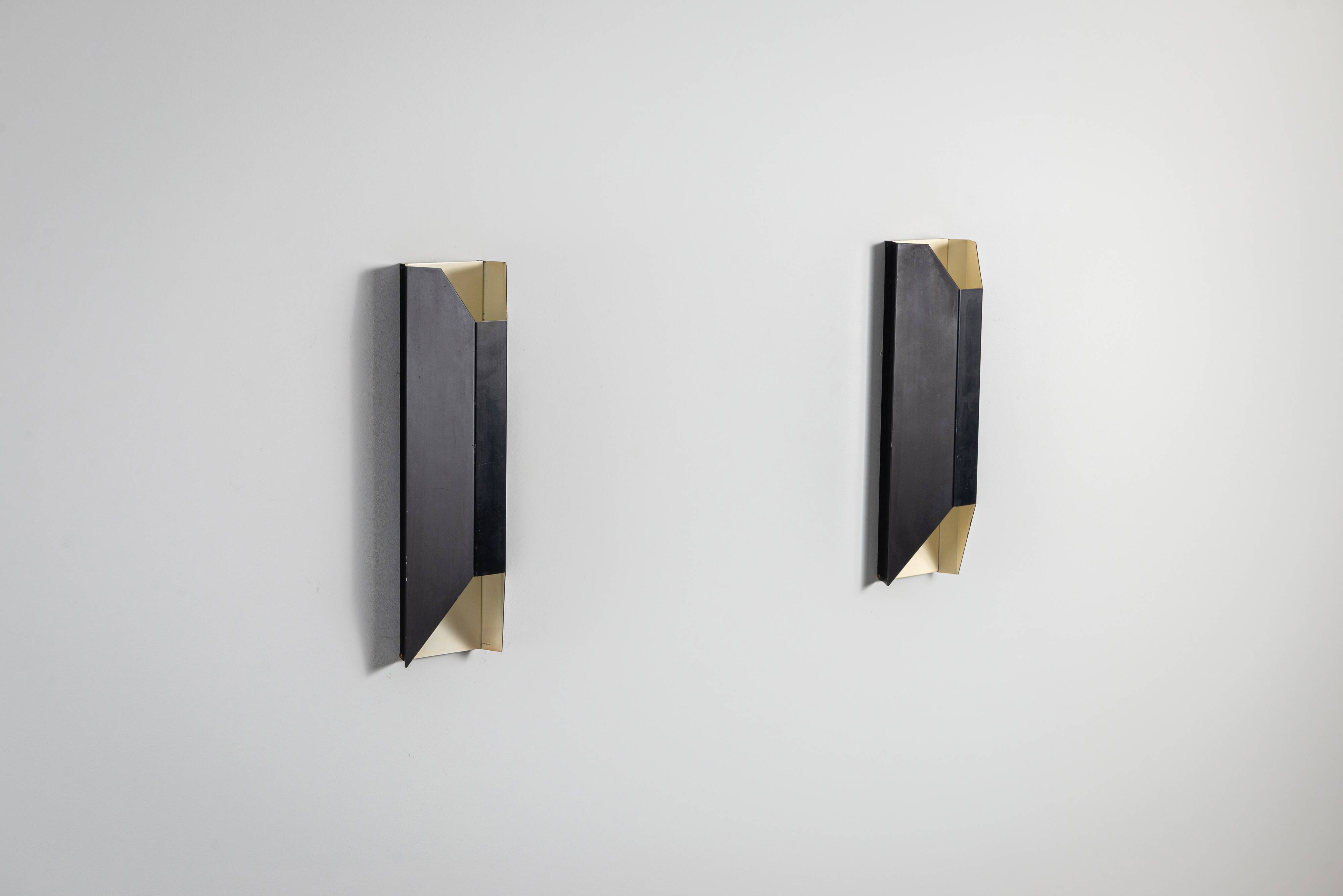 Architectural pair of vintage black metal wall lamps with angular geometric