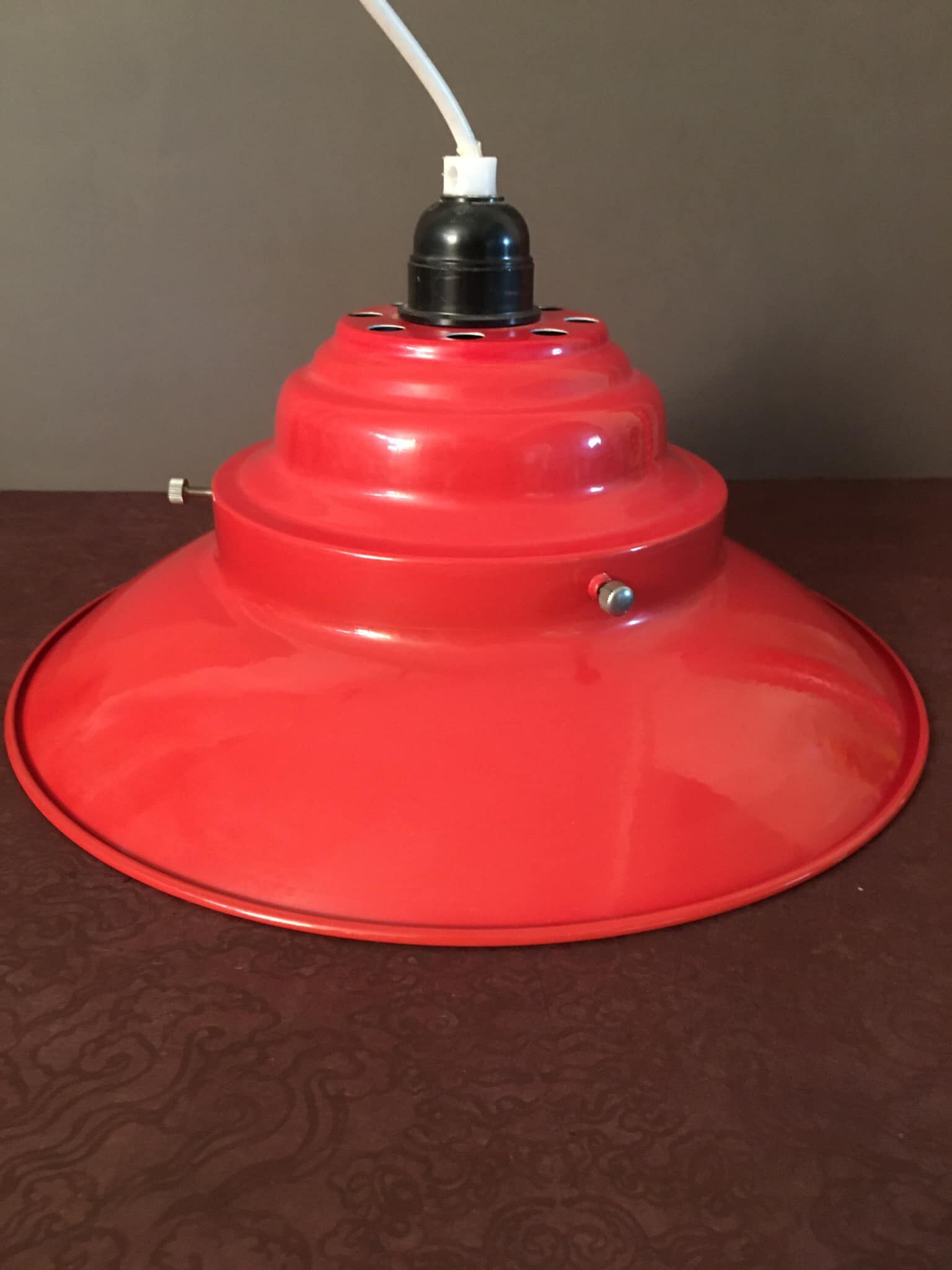 Industrial suspension in red metal