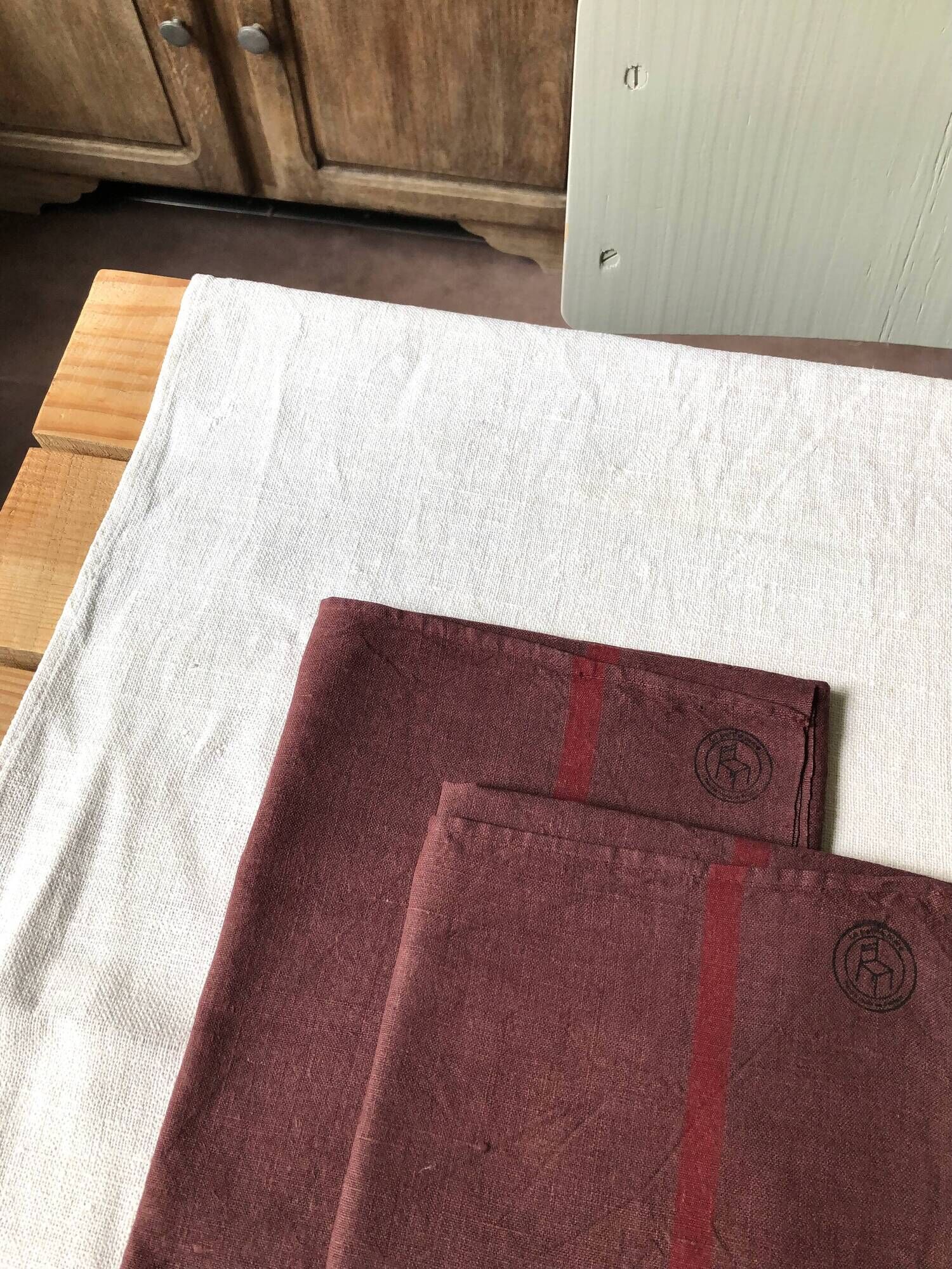 Set of two old tea towels in pure linen tinted in burgundy