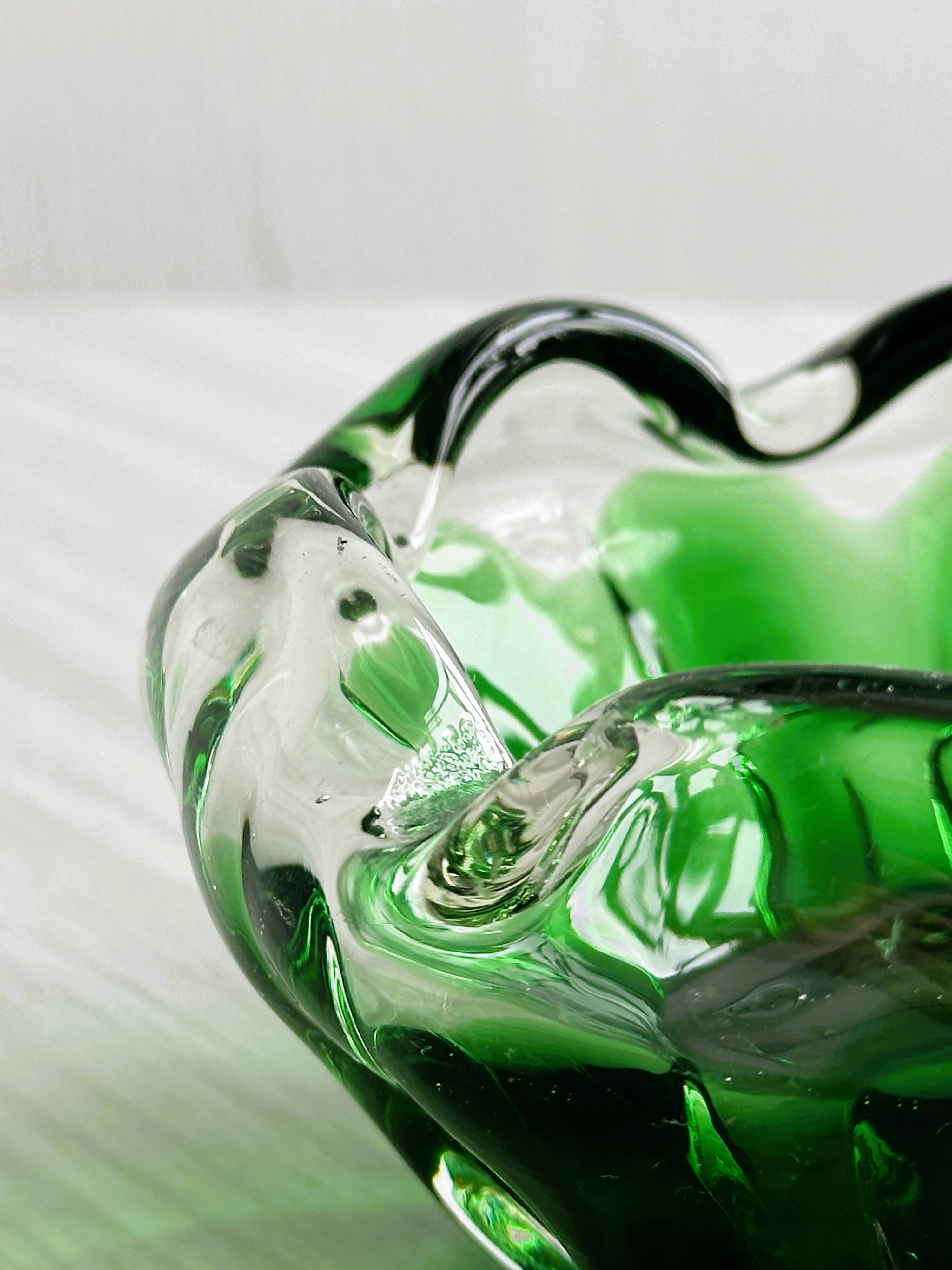 Translucent green ashtray.