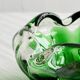 Translucent green ashtray.