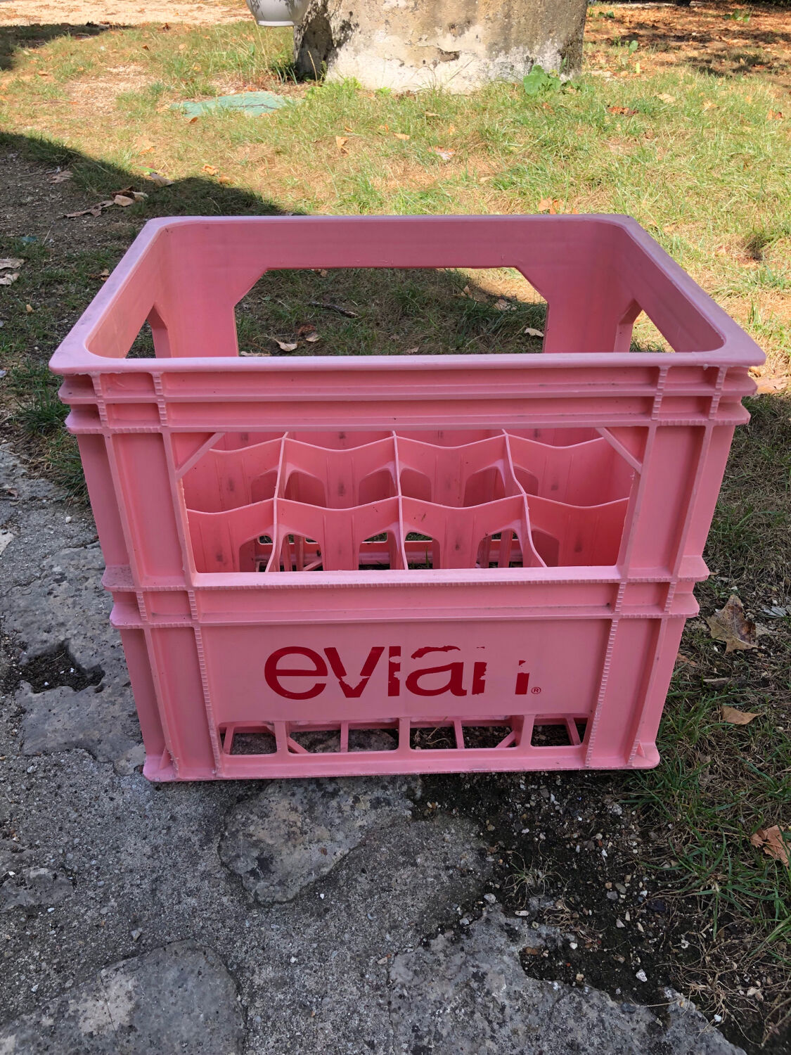 Evian bottle holder in pink plastic