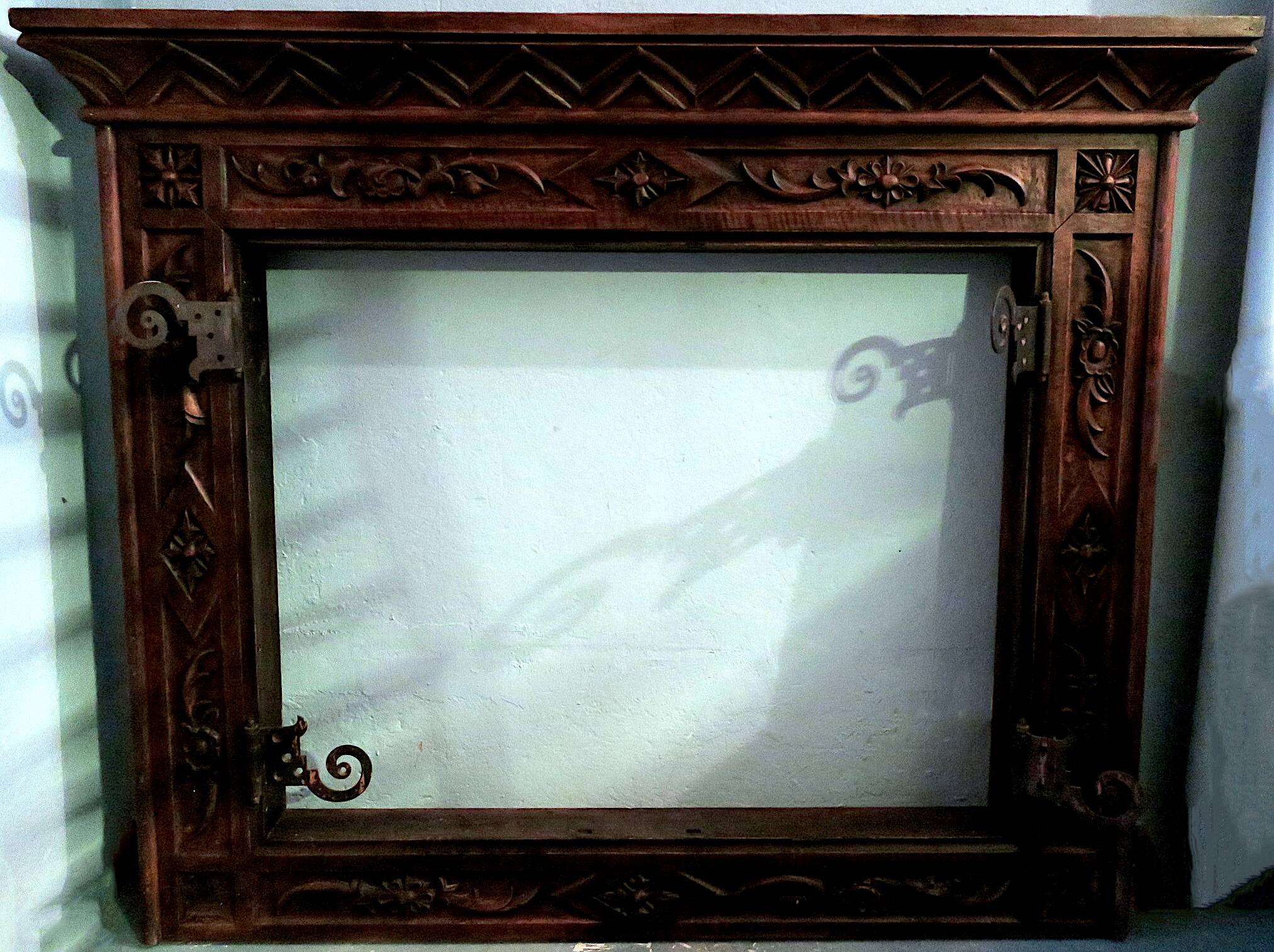 Art deco fireplace in carved solid teak and wrought iron, 1920