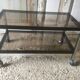 Metal coffee table with smoked glass.