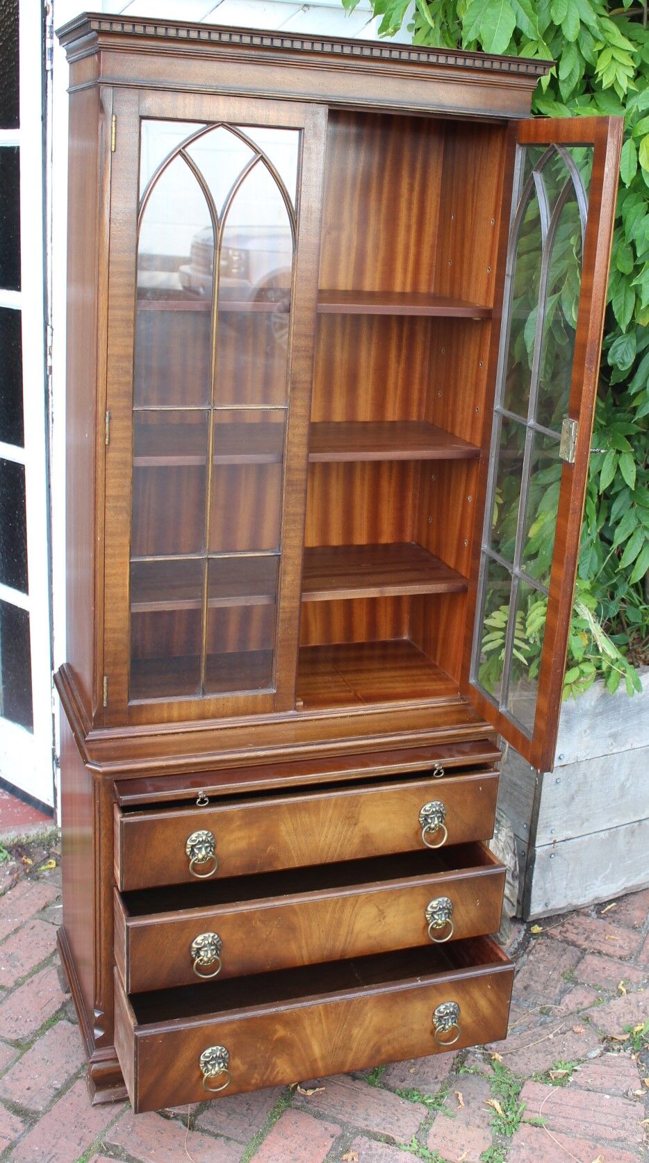 Mahogany bookcase with brushing slide