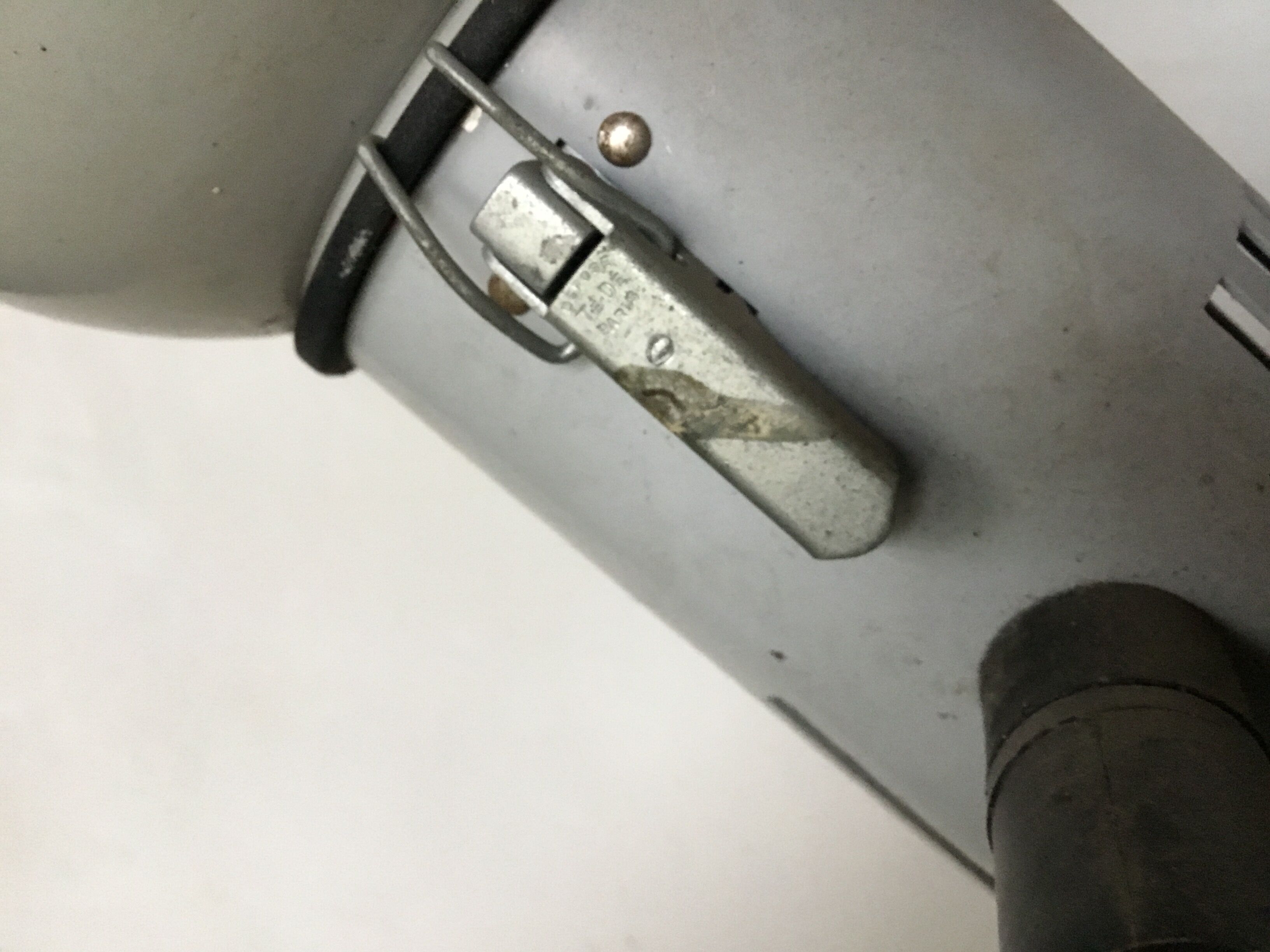 Industrial lamp on wrought iron tripod feet